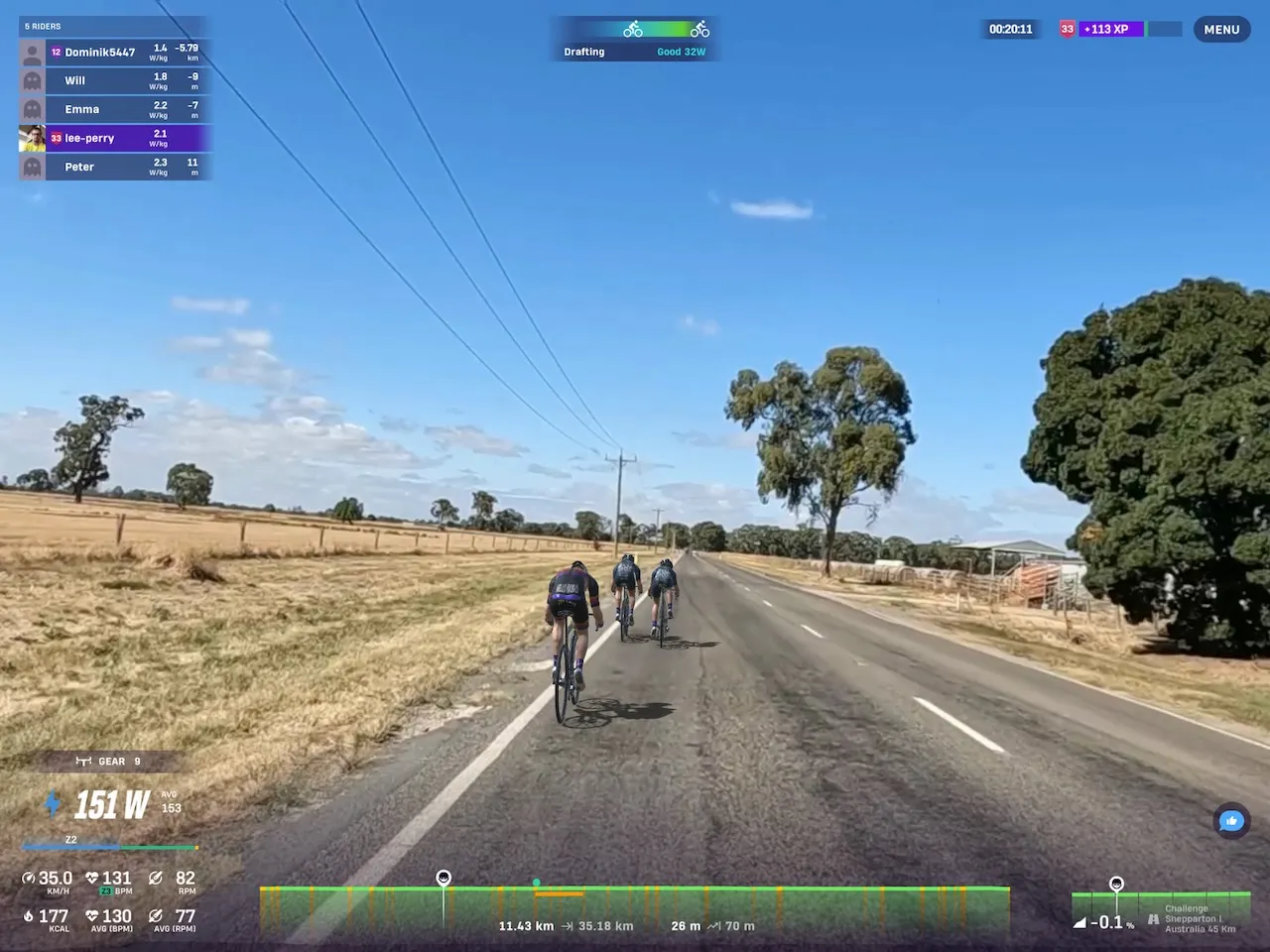 Riders avatars riding thrugh dried yellow fields with trees on Rouvy.