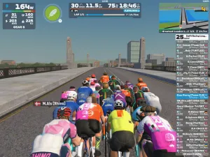 Cyclists avatars ride over a London bridge on Zwift