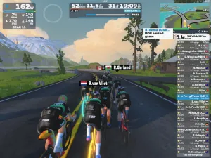 Cyclists's avatars riding through a group in the jungle on Zwift.