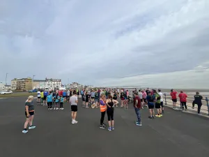 Looking along the course at Hartlepool Parkrun above participants at the start line on a clear day