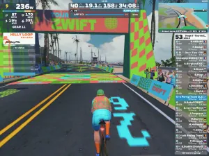 Riders avatar approaching a colorful start / finish banner on zwift