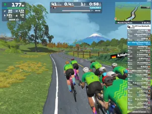 Riders avatars riding towards the conical Mount Fuji in Zwift's Makuri Islands world.