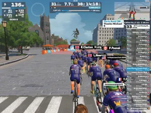 Riders avatars approaching a cyclist statue in Zwift's Richmond world