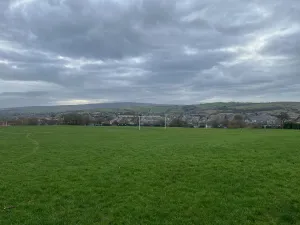 View across the Colne valley to hills beyond from Alkincoats park at the beginning of Pendle Parkrun