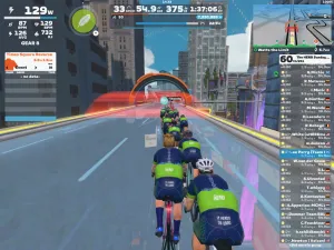 Riders' avatars riding on a glass road above New York City on Zwift